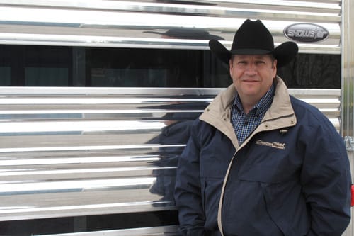 Kirk Stierwalt standing next to his Cimarron trailer.